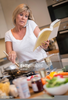 Busy Woman Cooking Image