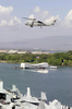An Sh-60b Seahawk Assigned To The Indians Of Helicopter Anti-submarine Squadron Six (hs-6), Passes By The Uss Arizona Memorial While Entering Pearl Harbor, Hawaii. Image