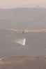 A Sea King Helicopter (uh-3h) Assigned To The  Golden Gators  Of Reserve Helicopter Combat Support Squadron Eighty Five (hc-85) Uses A  Bambi  Bucket To Conduct Water Drops On Brush Fires Image
