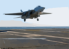 An F-14d  Tomcat  From The  Black Lions  Of Fighter Squadron Two One Three (vf-213) Lands On The Ship S Flight Deck After A Training Mission. Clip Art