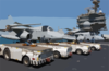 Tow Tractors Are Positioned On The Starboard Side Of The Flight Deck In Preparation For Aircraft Movement After The Conclusion Of Daily Flight Operations Aboard The Aircraft Carrier Uss Kitty Hawk (cv 63) Clip Art