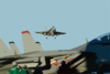 An F/a-18c Hornet Flies Over The Flight Deck Of Uss George Washington (cvn 73) Clip Art