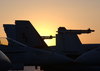 The Sun Rises Over One Of The F/a-18c Hornet Squadrons Deployed Aboard The Uss Theodore Roosevelt (cvn 71). Image