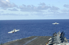 Two F/a-18e Super Hornets Assigned To The Tophatters Of Strike Fighter Squadron Fourteen (vfa-14) Launch From The Flight Deck Of Uss Nimitz (cvn 68) Image