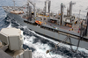 Usns Rappahannock (t-ao 204) Guides Over Hoses To Transfer Fuel To Kitty Hawk During A Replenishment At Sea (ras). Image