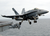 An F-18c Hornet Launches From Uss Abraham Lincoln. Image