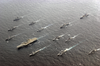 The Kitty Hawk Battle Group Align Themselves To Participate In A Photo Exercise Image