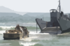 A Lighter Amphibious Re-supply Cargo (larc) Vehicle Drives Into The Waves Clip Art
