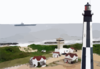 Precommissioning Unit (pcu) Ronald Reagan (cvn 76) Passes A Lighthouse Located At Fort Story Army Base Clip Art