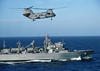 A Ch-46 Sea Knight Assigned To The  Gunbearers  Of Helicopter Combat Support Squadron One One (hc-11), Detachment One, Flies Alongside The Fast Combat Support Ship Uss Rainier (aoe 7). Image