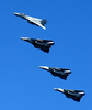 F-14dtomcats Fly Over The Deck Of Uss John C. Stennis (cvn 74) Image