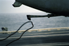 An Arresting Wire Falls Away From An S-3b Viking Image