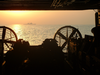 The Sunrises Behind A Landing Craft Air Cushion (lcac) During Well Deck Operations Aboard Uss Peleliu (lha 5), Lead Ship For Expeditionary Strike Group One (esg-1). Image
