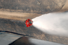 A Sea King Helicopter (uh-3h) Assigned To The Golden Gators Of Reserve Helicopter Combat Support Squadron Eighty Five (hc-85) Uses A Bambi Bucket To Conduct Water Drops On Brush Fires Image