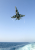 F/a-18 Hornet Makes Arrested Landing Aboard A Carrier At Sea. Image