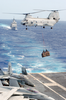 A Ch-46d Conducts A Vertical Replenishment Image