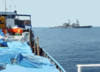 U.s. Navy Destroyer Inspects Merchant Vessel In The Arabian Gulf. Clip Art