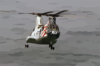 A Ch-46 Sea Knight Helicopter Conducts A Replenishment At Sea (ras) With Uss Kitty Hawk (cv 63). Clip Art