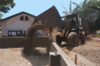 A Front Loader Assigned To The  Club And Spades  Of Naval Mobile Construction Battalion Two Five (nmcb 25), Pours Earth To Be Used In The Building Of A Foundation At The Manuel Memorial Elementary School. Clip Art