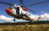 A Uh-3h Sea King Helicopter Assigned To Fleet Logistics Search And Rescue Team, Naval Air Station Whidbey Island, Conducts Hovering Exercises During A Training Flight Image