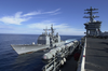 Uss Princeton (cg 59) Pulls Alongside Nimitz And Prepares To Receive Lines For A Replenishment At Sea (ras) Image