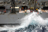 Sailors Aboard The Fast Combat Support Ship Uss Sacramento (aoe 1) Work To Maintain Control Of The Lines In High Winds And Heavy Seas During An Underway Replenishment (unrep) Image