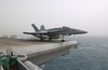 An F/a-18c Hornet Launches From One Of Four Steam-powered Catapults Aboard The Aircraft Carrier Uss Kitty Hawk (cv 63) Image