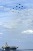 Aircraft Aboard Uss George Washington, Execute A Formation Fly-by Above The Aircraft Carrier. Image