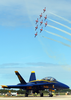 The   Canadian Snowbirds  Fly Nine Ct-114   Tutors  Over One Of The Blue Angels F/a-18  Hornets  During The   2002 Neptune Festival Air Show. Image