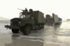 A 5-ton Truck Roles Off Of A Landing Craft Utility (lcu) From The Uss Tarawa Amphibious (lha 1) Ready Group (arg) To Be Used For Future Operations. Clip Art