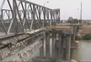 Seabees Assigned To Naval Mobile Construction Battalions (nmcb) Four And One Thirty-three Build A Bridge Over The Tigris River As Part Of The Humanitarian Assistance Phase Of Operation Iraqi Freedom Image