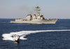 The Arleigh Burke-class Guided Missile Destroyer Uss Roosevelt (ddg 80) And A Small Boat Participate In A Simulated Small Boat Attack Exercise (swarmex) Image