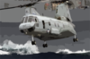 A Ch-46 Sea Knight Carries Supplies And Stores During A Vertical Replenishment (vertrep) Clip Art