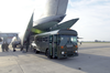 A Transport Bus From The U.s. Navy S Fleet Hospital Eight Backs Into The Tail Of A Waiting Air Force C-5 Galaxy Medical Evacuation (medevac) Plane. Image