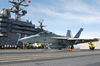 An F/a-18f Launches From The Ship Image