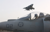 An Av-8b Harrier Begins Its Vertical Landing Aboard Uss Bonhomme Richard (lhd 6) Image