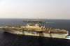 The Amphibious Assault Ship Uss Iwo Jima (lhd 7) And Uss Nimitz (cvn 68) Participate In Air Operations In The Arabian Gulf Image