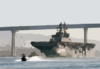 The Amphibious Assault Ship Passes Under The Coronado Bridge As She Makes Her Way Out Of The San Diego Bay Clip Art