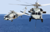 Two Mh-60s Knighthawk Helicopters Assigned To The  Providers  Of Helicopter Composite Squadron Five (hc-5) Pass One Another During A Replenishment Detail With Uss Kitty Hawk (cv 63) Clip Art