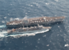 An F-14b Tomcat, From Carrier Air Wing Seven (cvw-7), Launches Off The Flight Deck Aboard Uss George Washington (cvn 73) While The Military Sealift Command (msc) Ship Usns Supply (t-aoe 6) Steams Alongside During A Replenishment At Sea. Clip Art