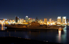 A Tugboat Tows The Decommissioned Aircraft Carrier Midway Into San Diego Bay. Image