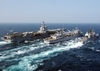 The Nuclear Powered Aircraft Carrier Uss Enterprise (cvn 65), Fast Combat Support Ship Uss Detroit (aoe 4), And The Guided Missile Cruiser Uss Gettysburg (cg 64) Perform A Replenishment At Sea. Image